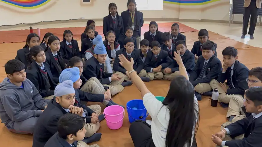 YSGI facilitators and students taking part in a school workshop